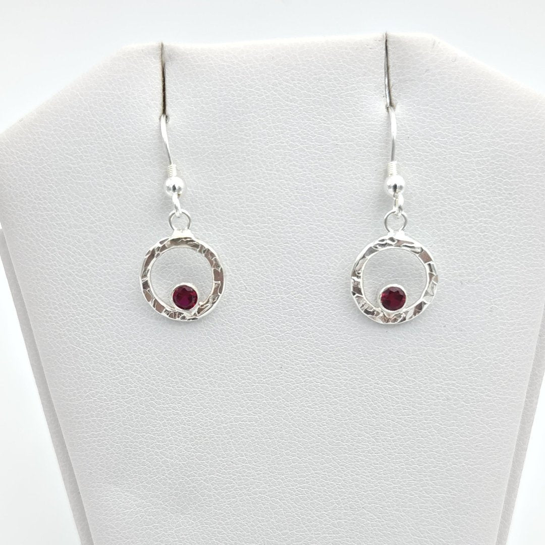 Sterling silver hammered halo and garnet earrings